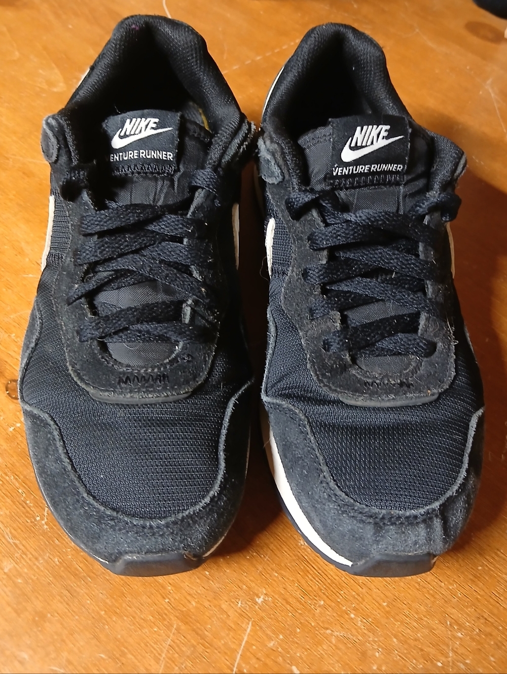Nike Women's Black and White Venture Runner Sneakers